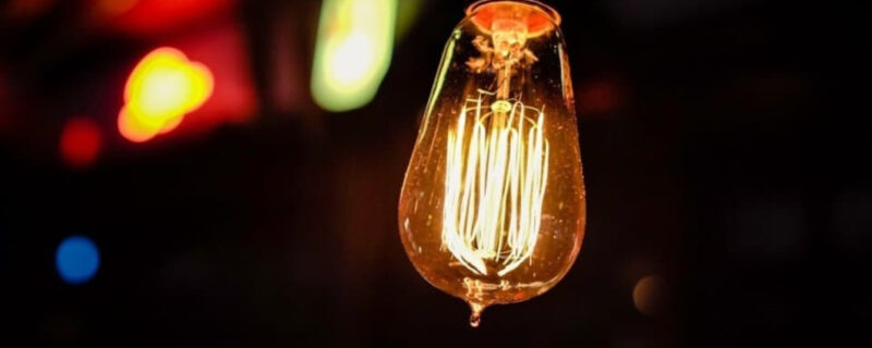 A closeup of a lit lightbulb