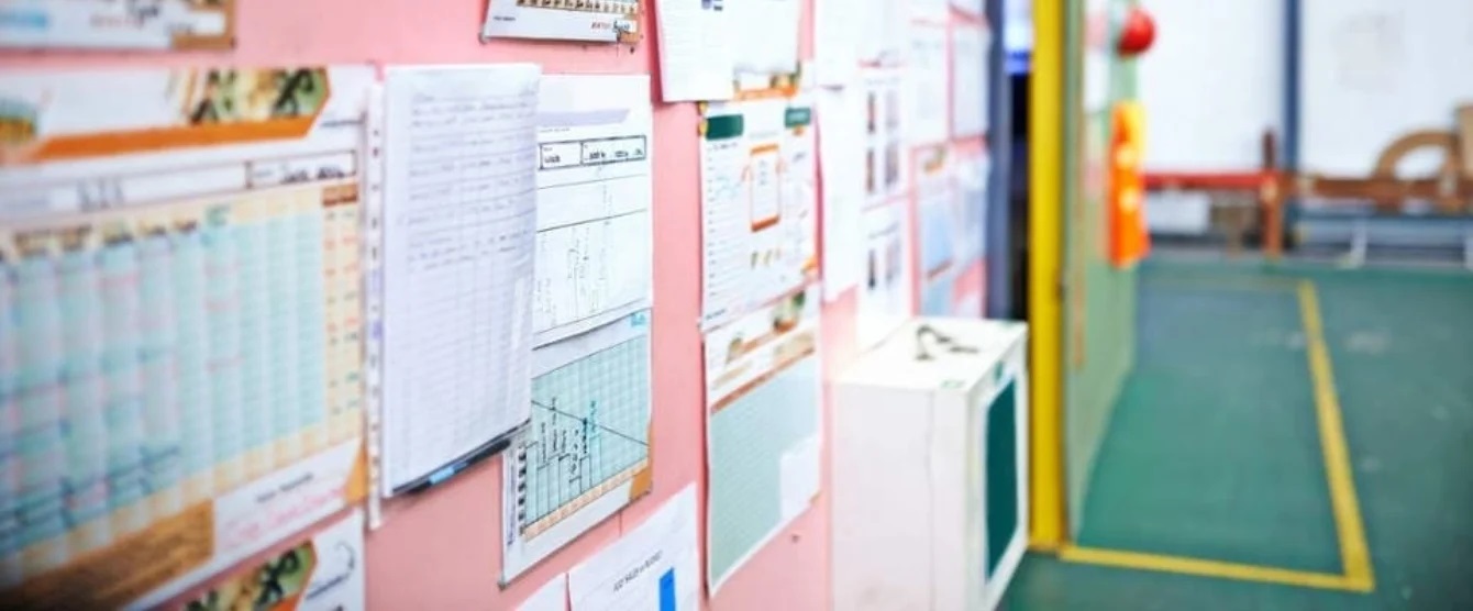 A wall with important papers hung on it