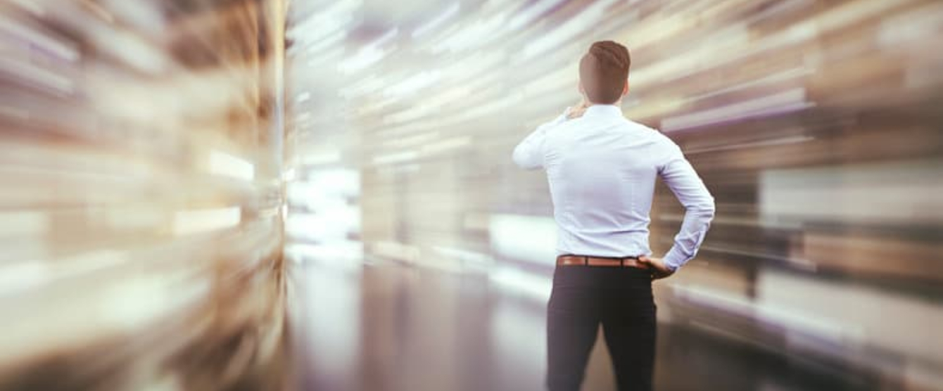 A fast action camera shot of a man standing looking at something