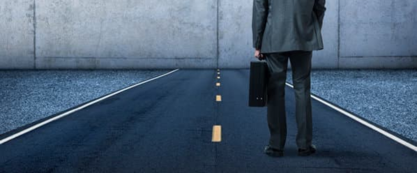 Businessperson walking on the road