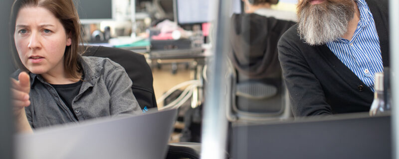 A man sitting at a desk with a computer