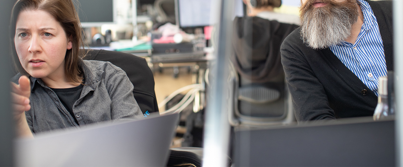 A man sitting at a desk with a computer