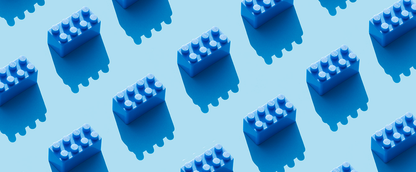 A series of blue lego pieces in straight lines