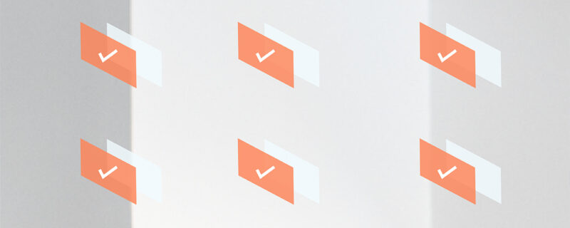 A graphic of orange squares with white checkmarks inside of them